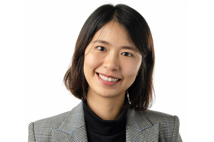 Professor Zhang wearing a grey blazer and black dress shirt